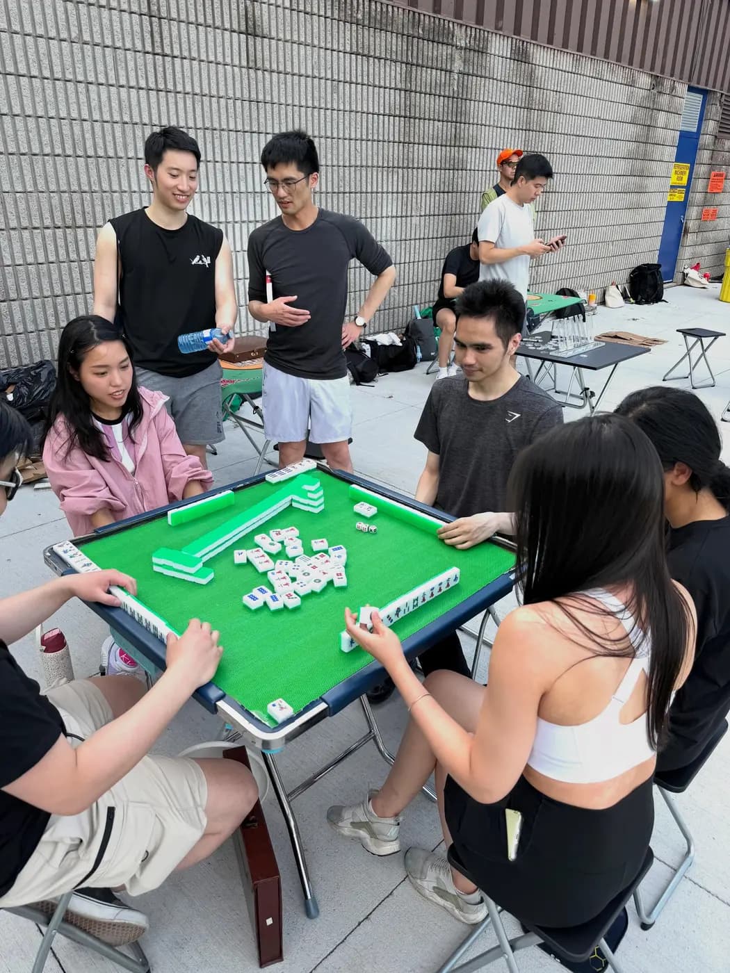 Members playing table games between matches at a social